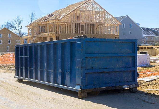 a large commercial dumpster alongside loading dock